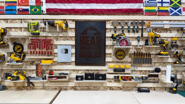 Real wooden French-cleat wall with removable plywood hand-tool and power-tool holders